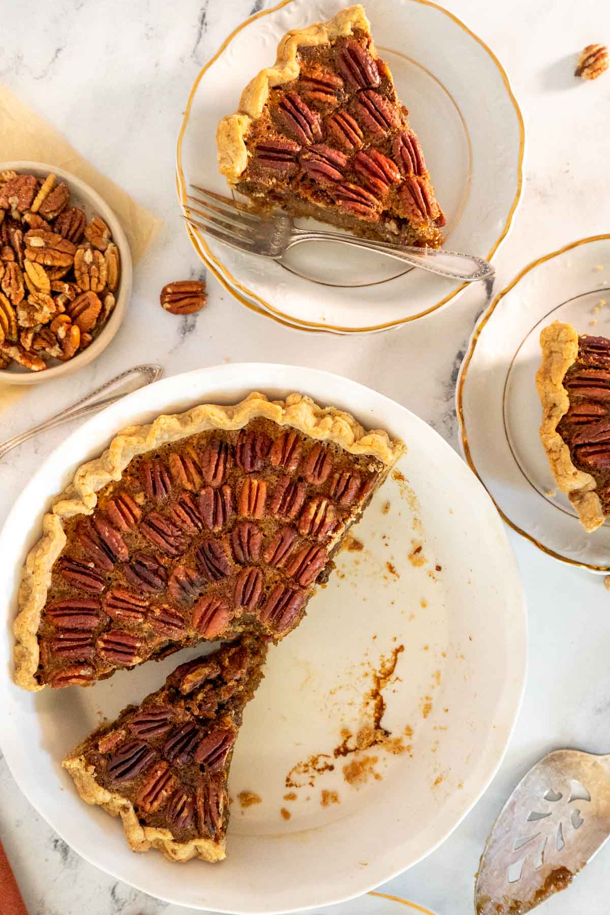 Pecan pie in a white pie pan.