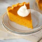 Slice of pie with whipped cream.