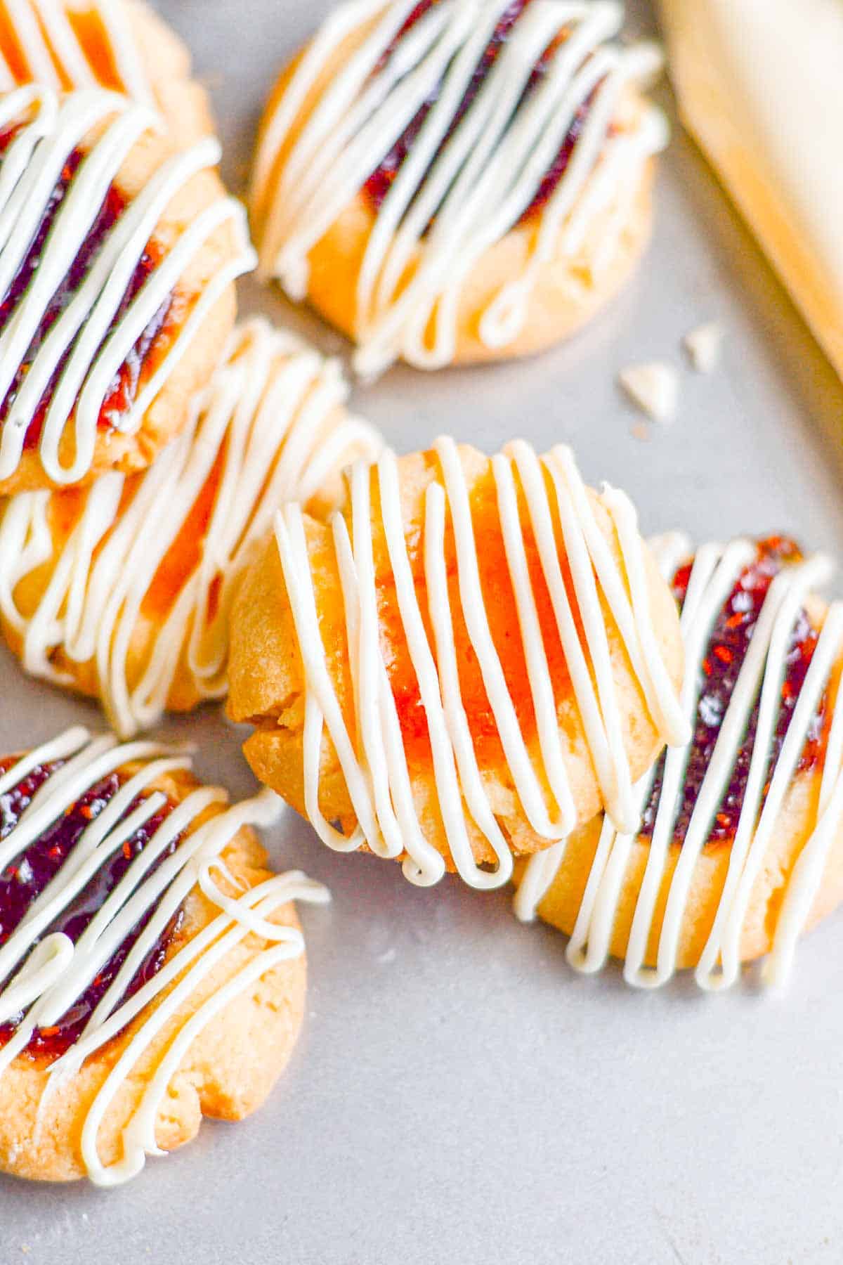 Thumbprint cookies on a baking sheet.