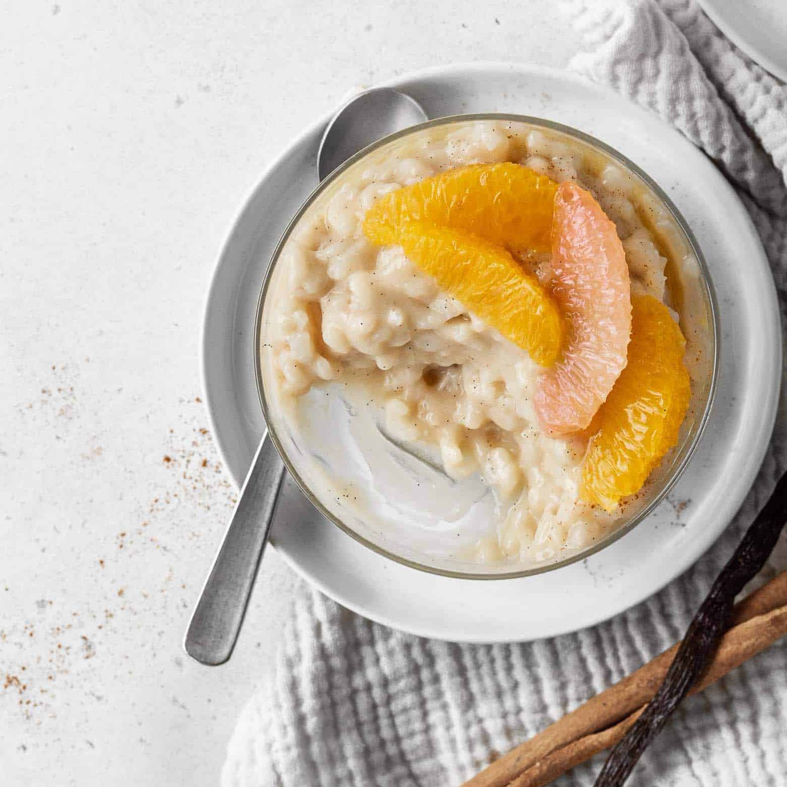 Bowl of pudding with oranges.