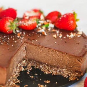 Chocolate cheesecake with strawberries on top.