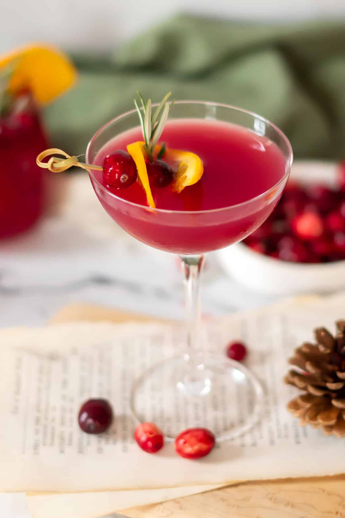 Coupe glass with cranberry drink.