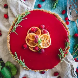 Cranberry pie topped with rosemary and oranges.