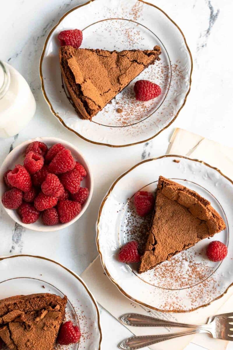 Slices of cake on white plates.
