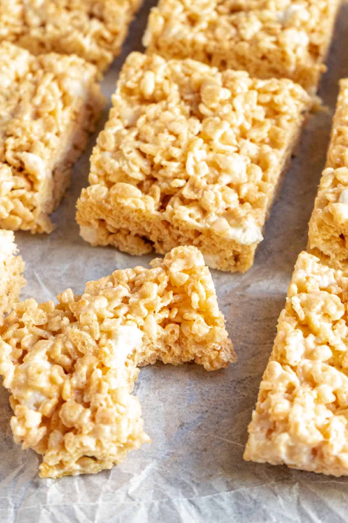 Rice krispies treat with a bite taken out of it.