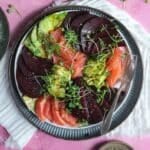 Beet salad on a plate with a fork.