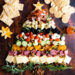 Christmas cheese board with veggies and fruit.