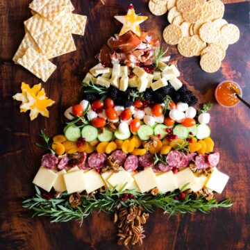 Christmas tree charcuterie board with meats and cheese.