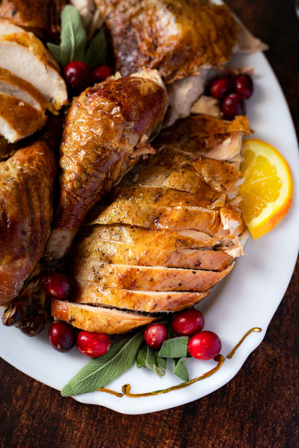 Roasted turkey with sage and sliced oranges.