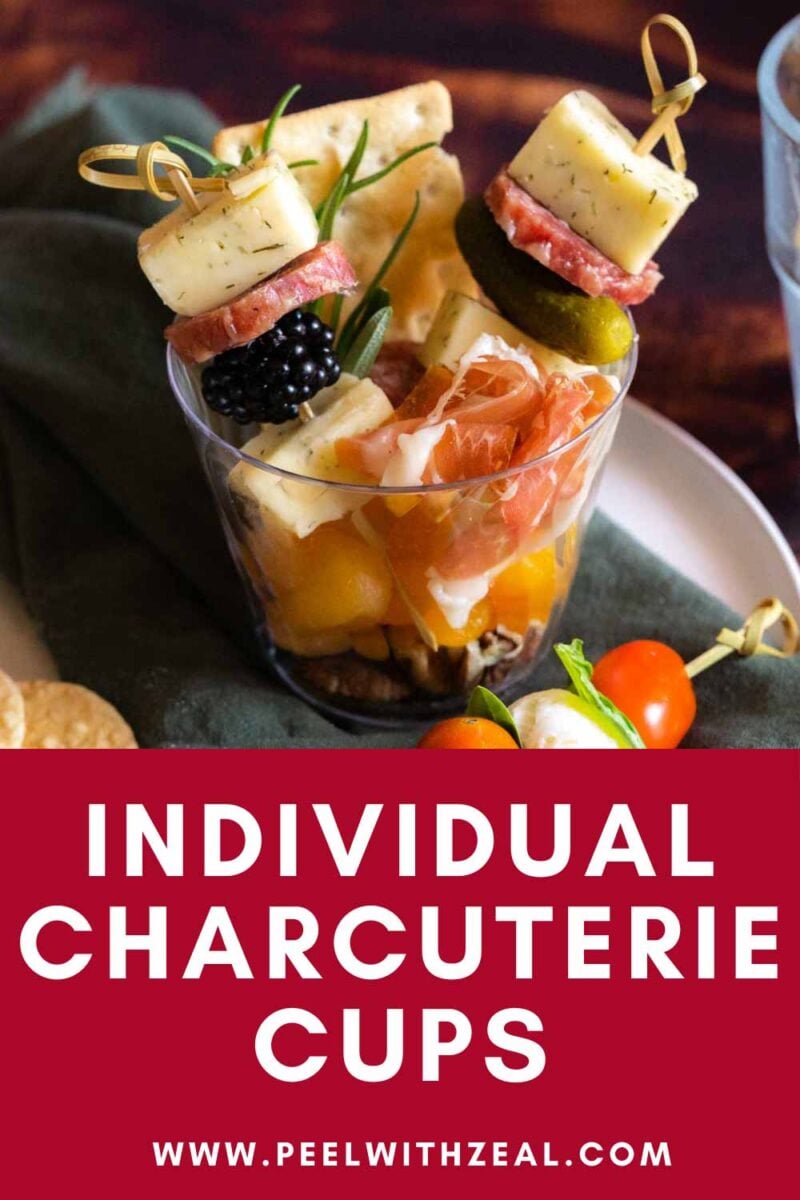 Charcuterie and cheese skewers in a cup.