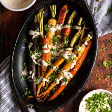 Roasted rainbow carrots in a baking dish.