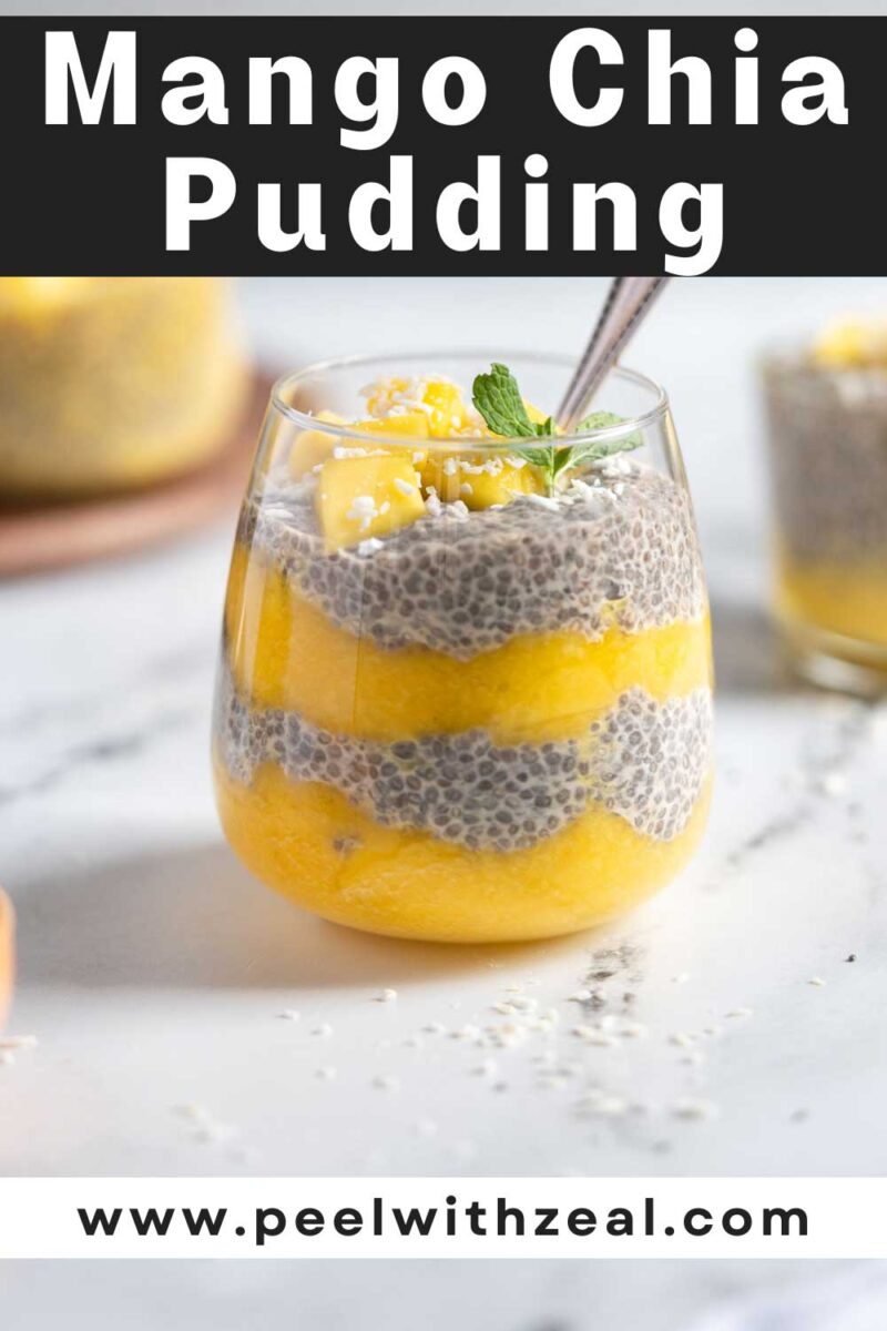 Mango chia pudding in a glass with a spoon.