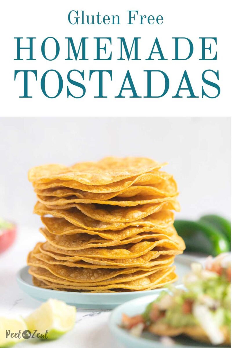 Tostada shells stacked on a plate.