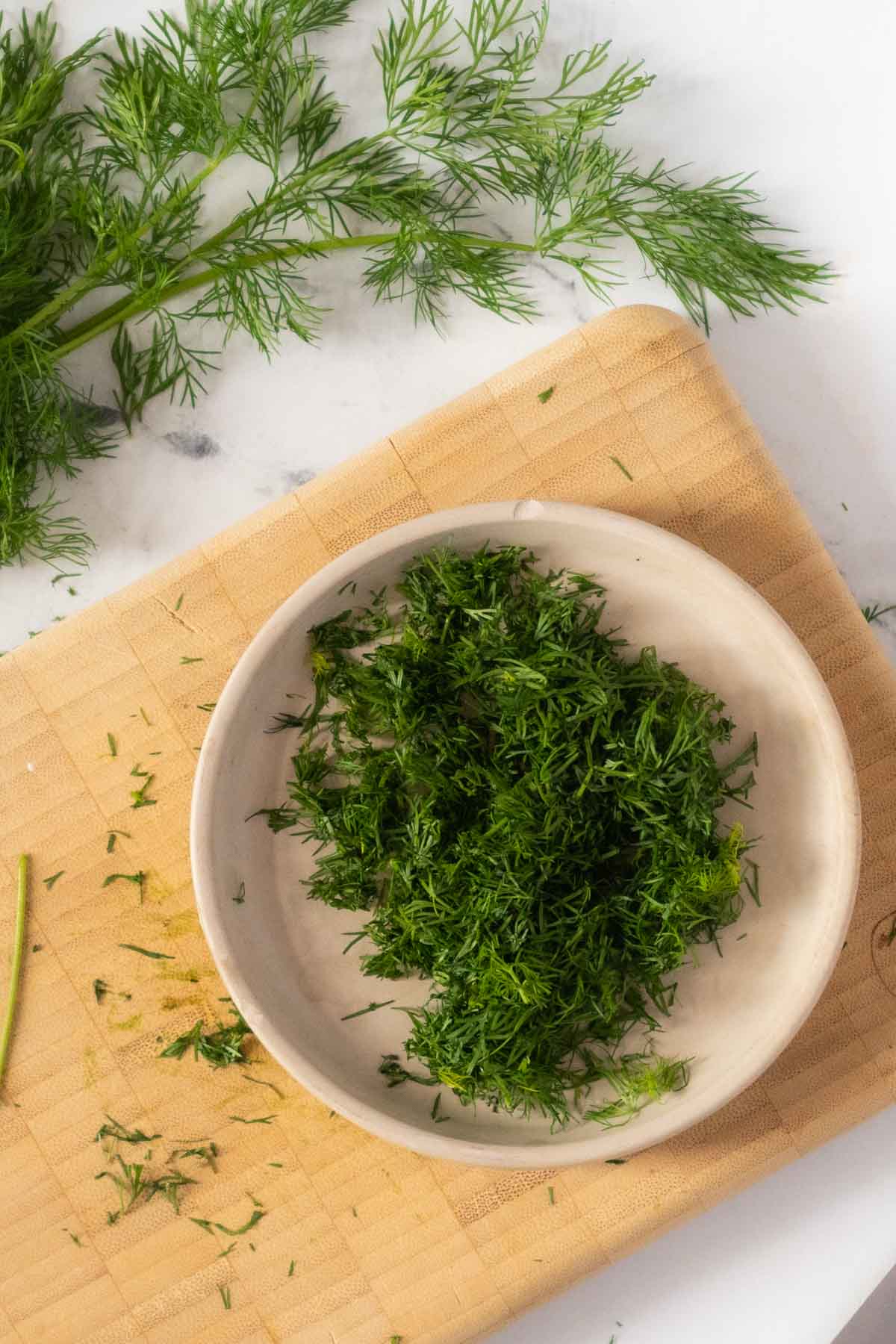 Chopped dill in a bowl.