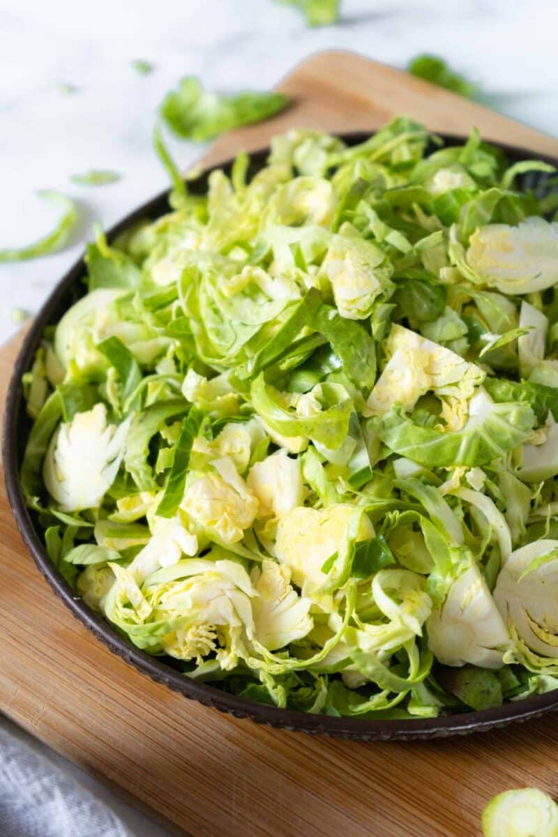 Sliced brussels sprouts on a plate.