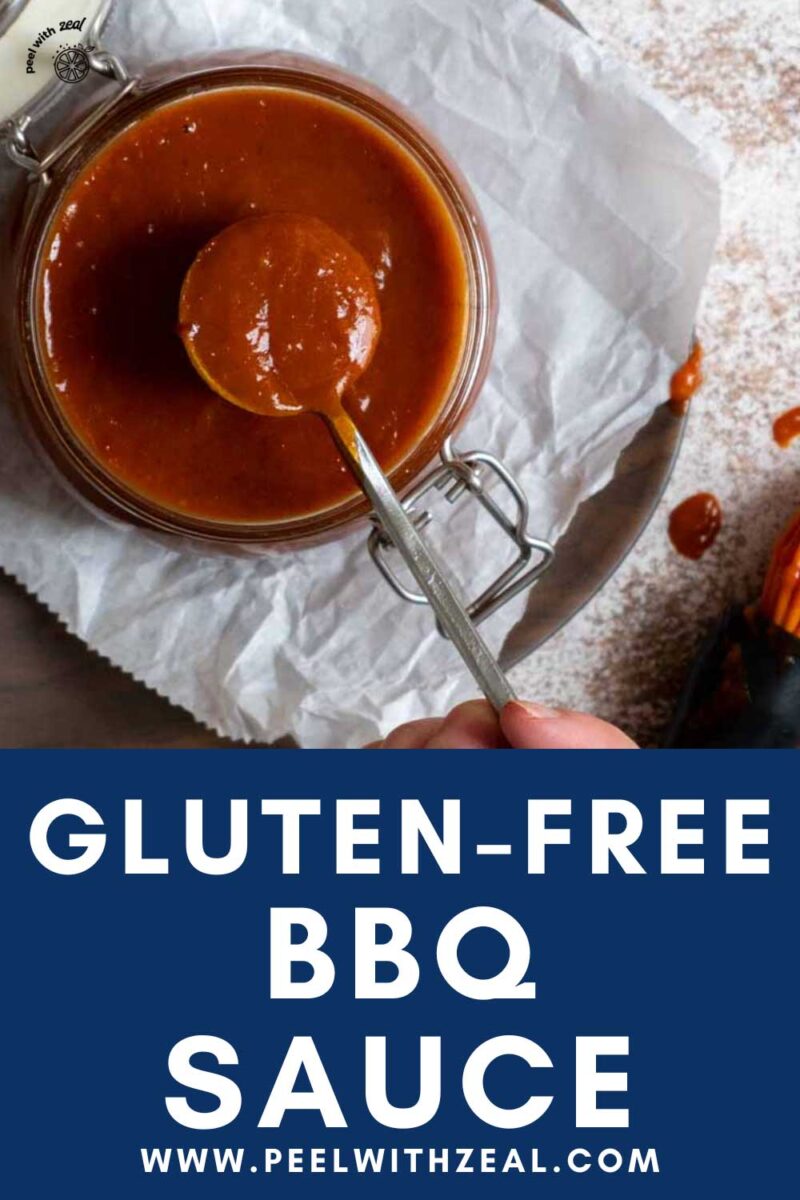 BBQ sauce in a jar with a spoon.