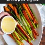 Pouring sauce on carrots and asparagus.