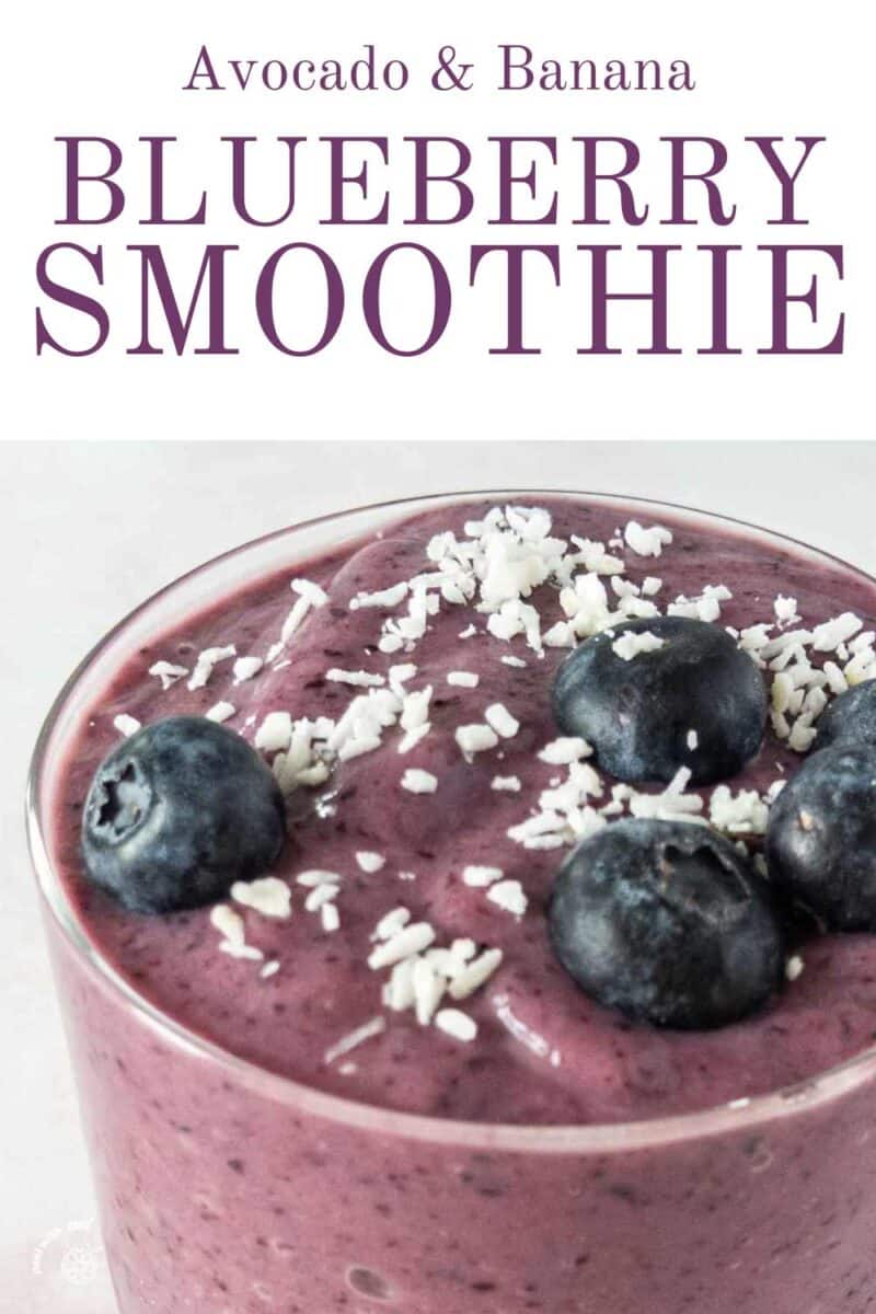 Smoothie in a glass with blueberries.