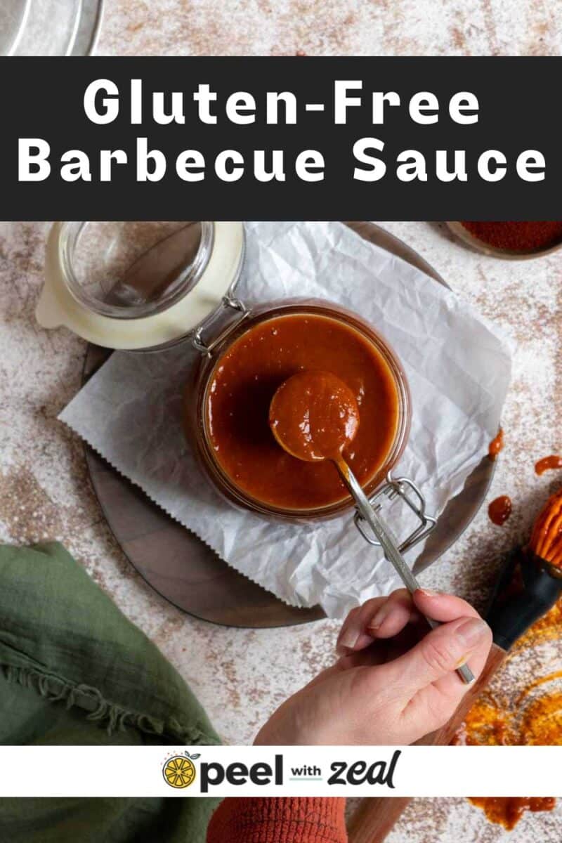 BBQ sauce in a jar with a spoon.