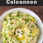 Colcannon in a white bowl with vegan butter.