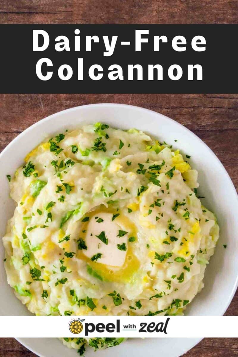 Colcannon in a white bowl with vegan butter.