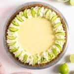 Key lime pie with whipped topping and lime slices.