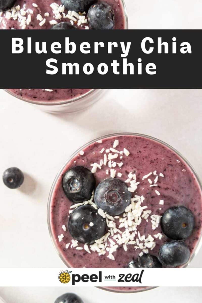 Two smoothies in a glass with blueberries and coconut.