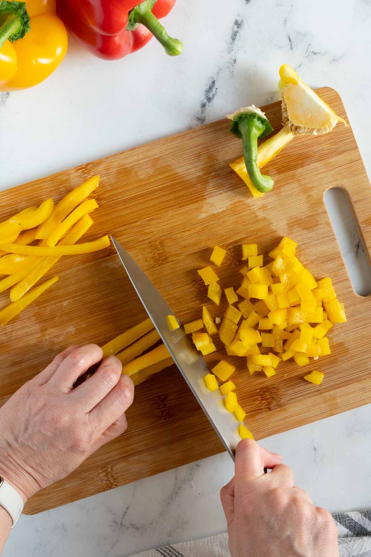 Dicing a yellow pepper.