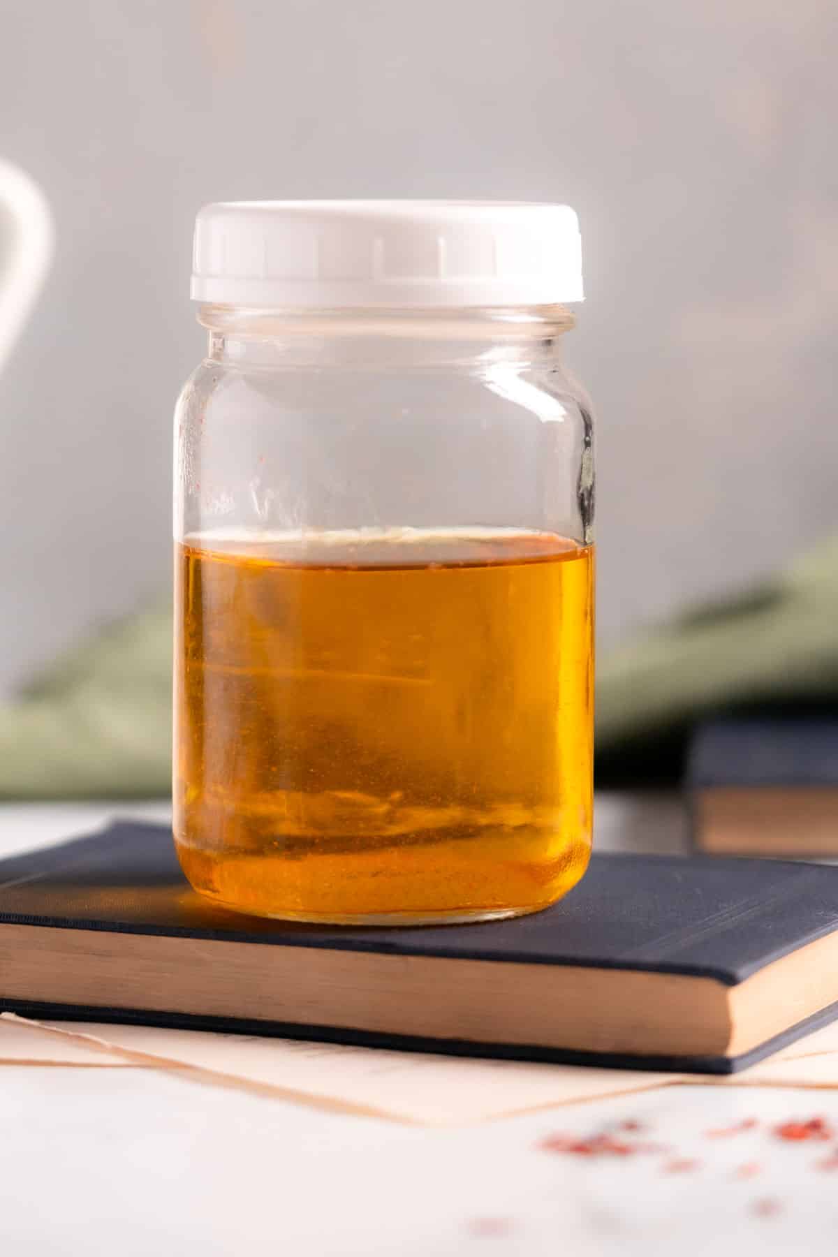 Saffron water being stored in a jar.