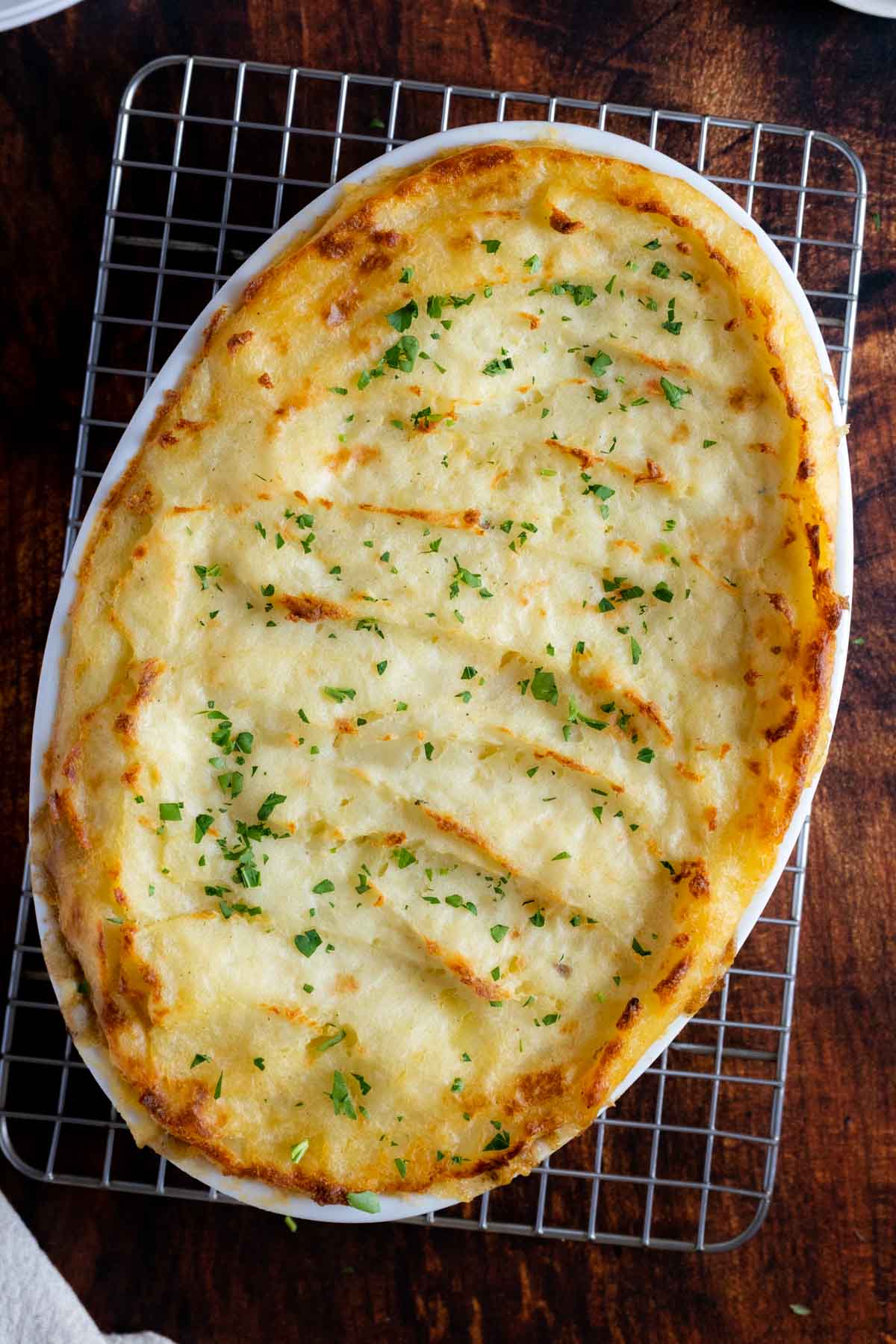 Casserole cooling on a baking rack.