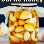 Garlic and honey in a jar with a cloth top.