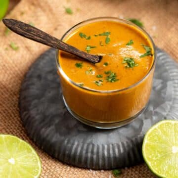 Chicken marinade in a bowl with limes.