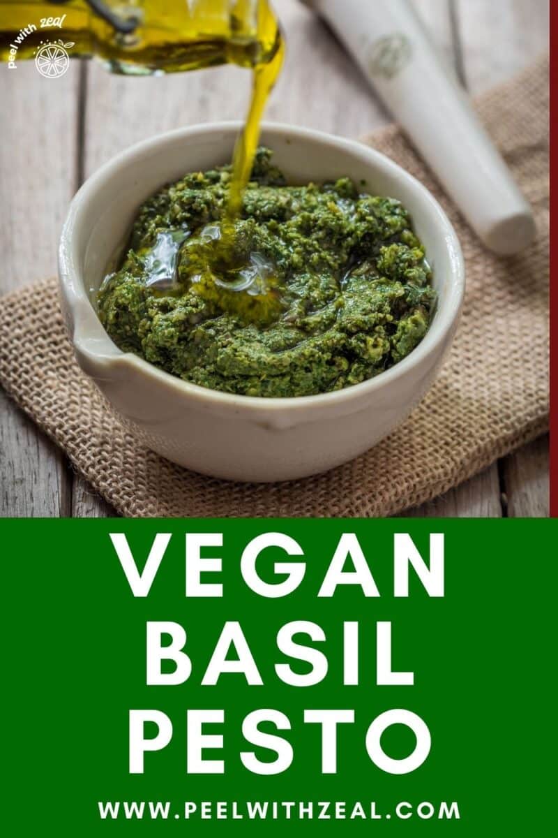 Basil pesto in bowl with olive oil.