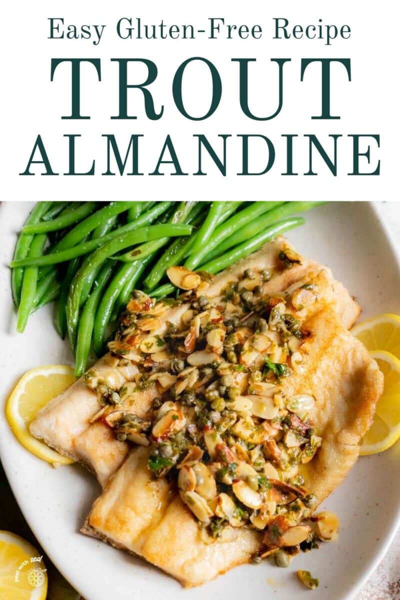 Trout with a brown butter almond sauce on a plate.