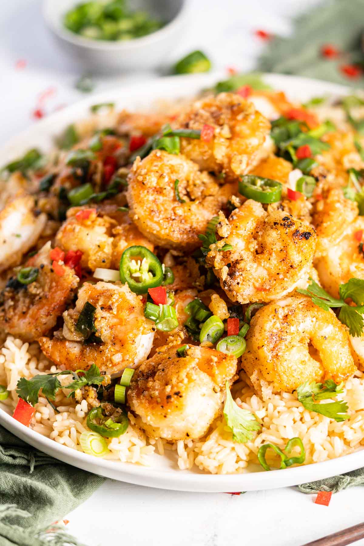 Crispy shrimp served over rice with spicy sliced peppers.
