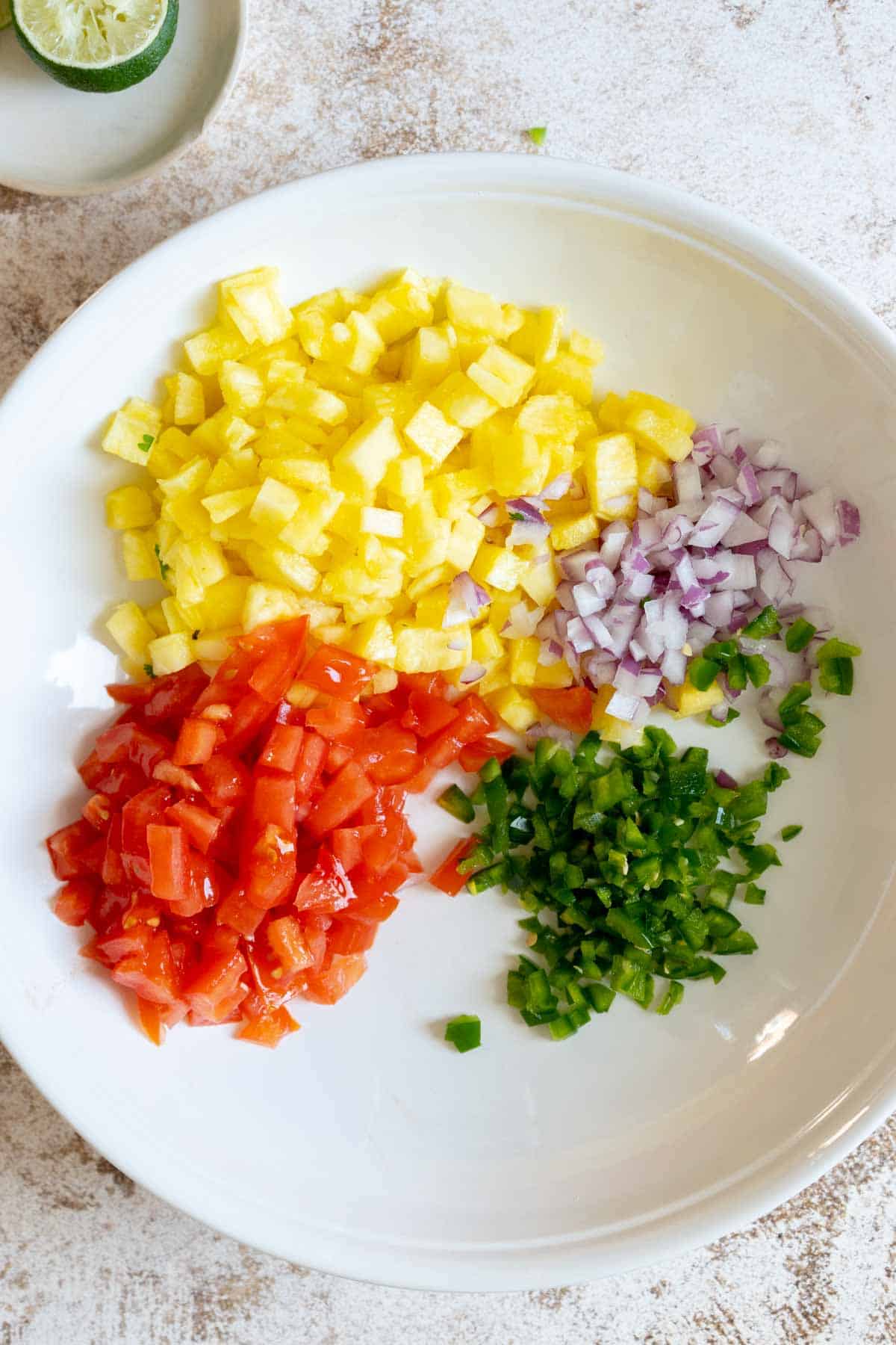 Chopped ingredients in a mixing bowl.