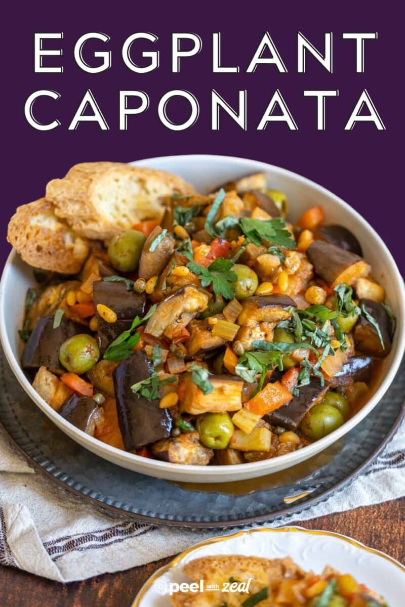 Caponata in a bowl with toasted bread.