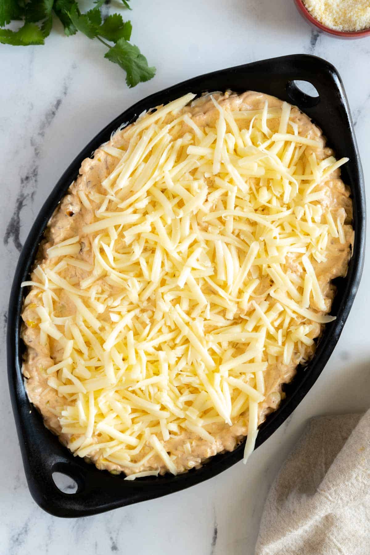 Dip in a pan topped with cheese before baking.