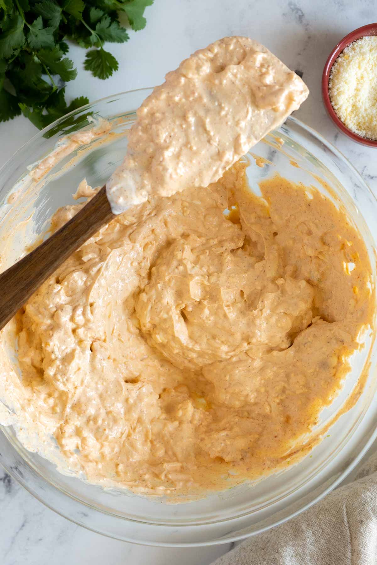 Cream mixture mixed together in a mixing bowl.