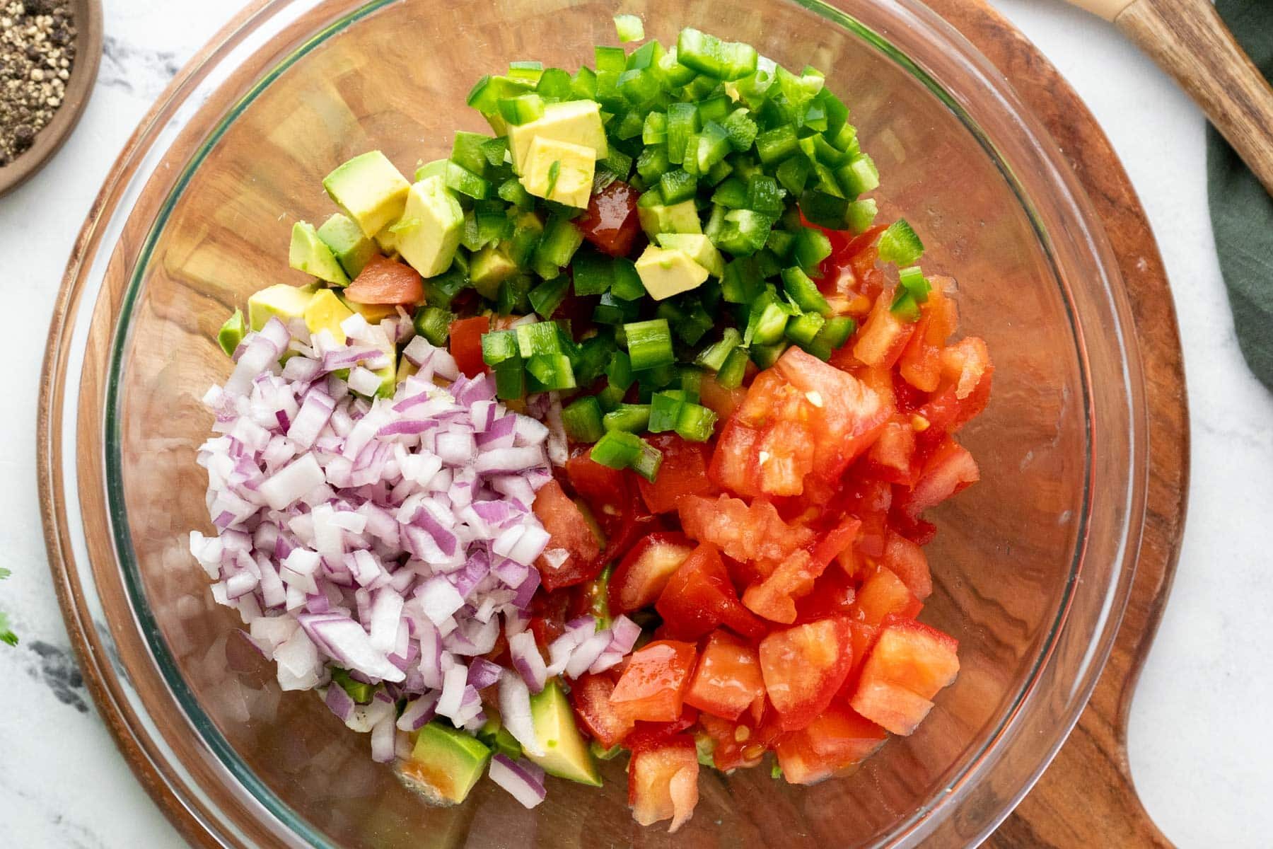 Adding raw ingredients to a bowl.