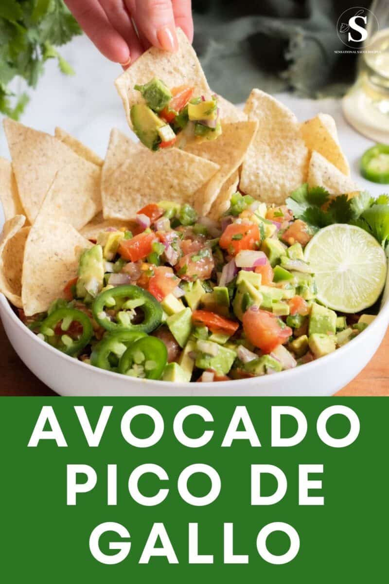 Dipping chip into avocado pico.