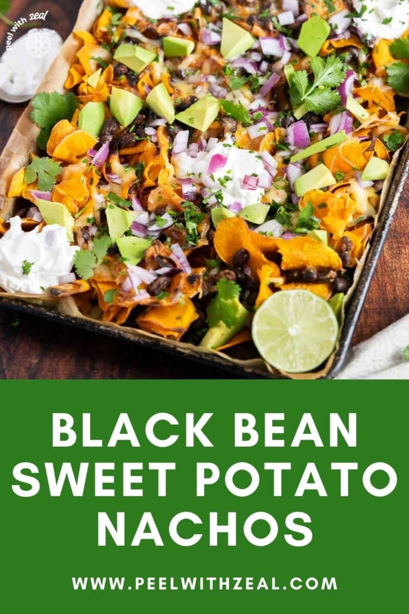 Sweet potato nachos on a tray with cheese and chopped vegetables.