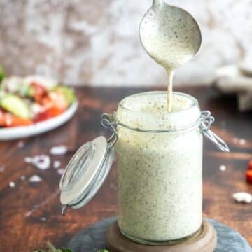 Creamy poppy seed dressing in a bottle.