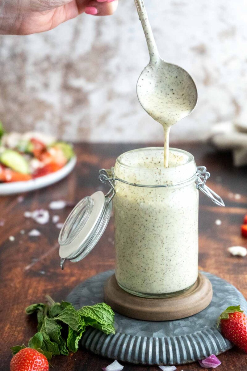 Creamy poppy seed dressing in a bottle.