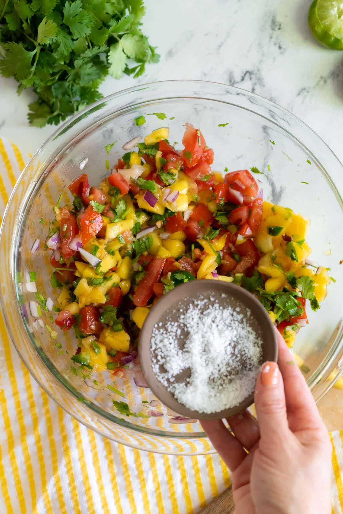 Salting the dish.