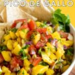 Mango pico in a bowl with tortilla chips.