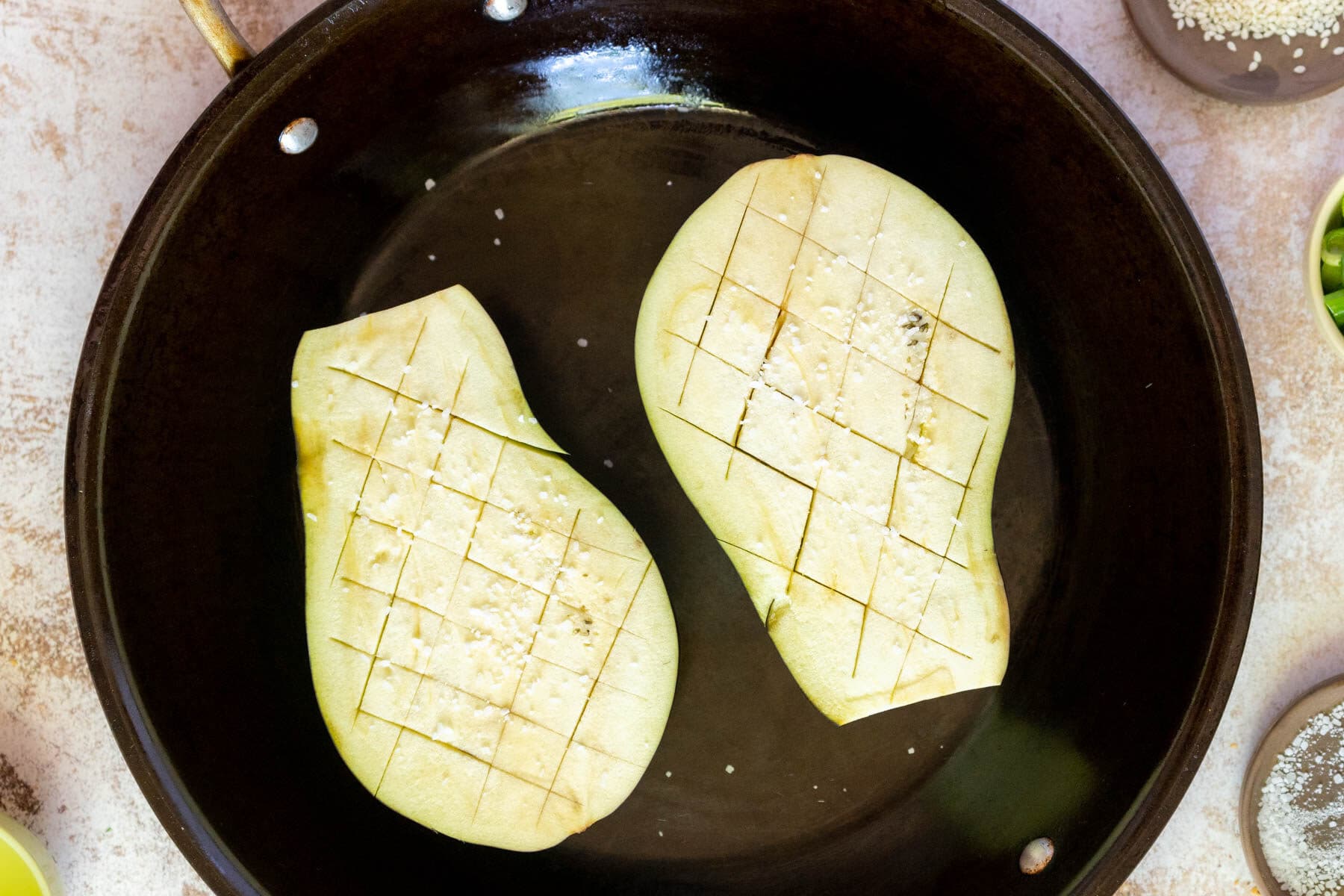 Cooking the eggplant skin side down. 