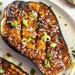Crosshatched baked eggplant with sesame.