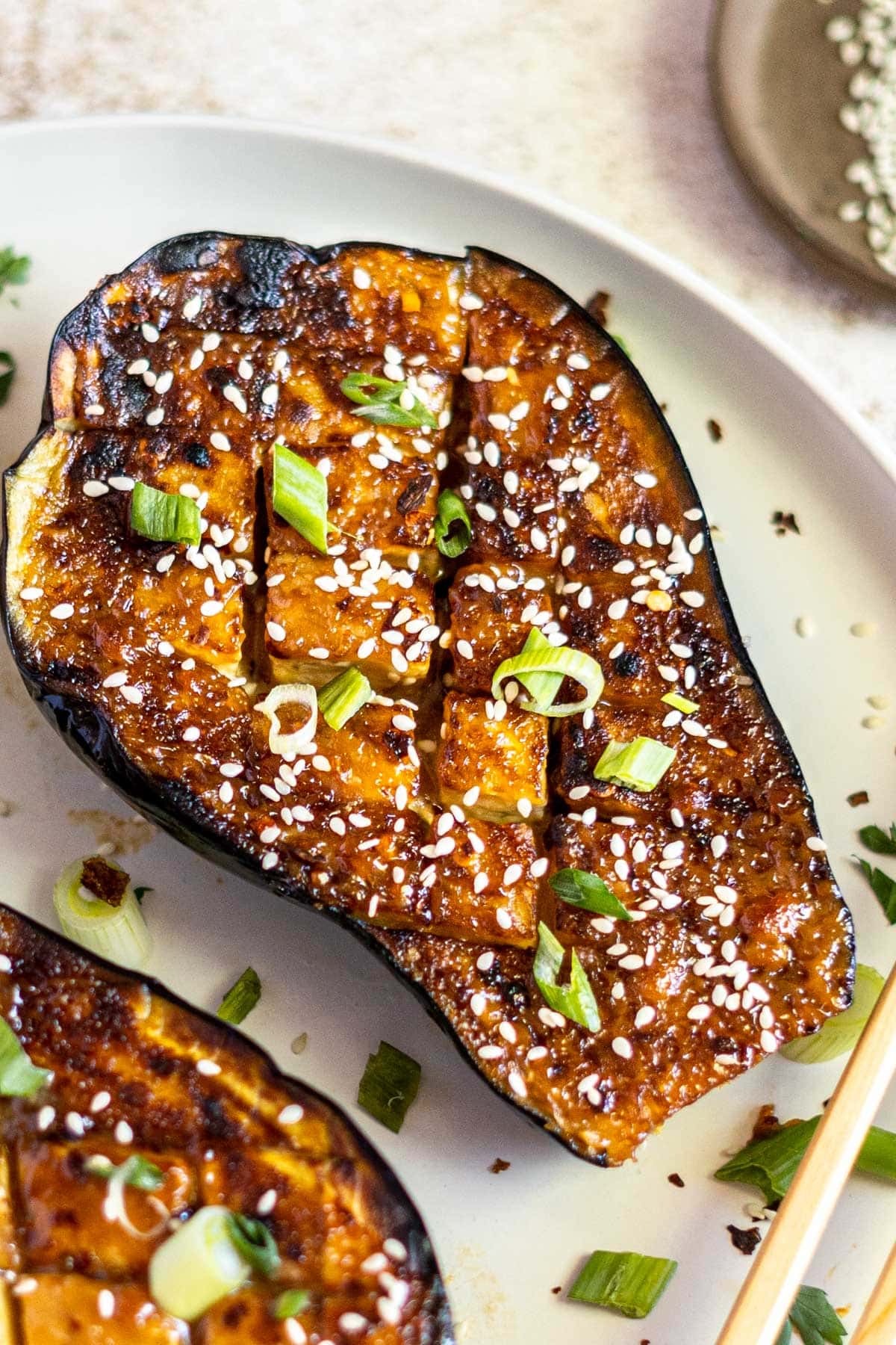 Crosshatched baked eggplant with sesame.
