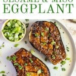 Miso baked eggplant with scallions on a plate.